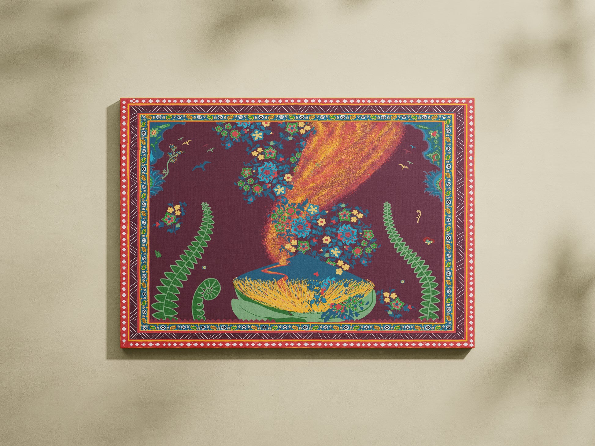 A canvas art print featuring a colorful fantasy illustration, displayed against a warm beige wall with soft leaf shadows.
